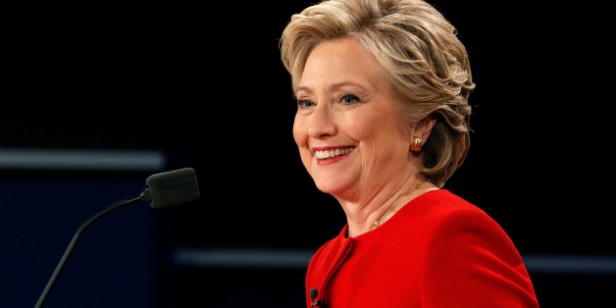 Democratic U.S. presidential nominee Hillary Clinton smiles during the first presidential debate with Republican U.S. presidential nominee Donald Trump at Hofstra University in Hempstead